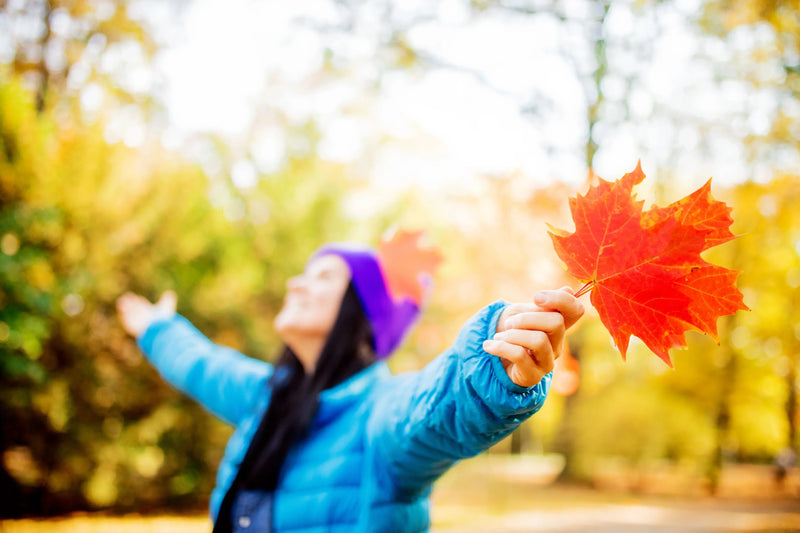 girl with leaf on fall season alley - Embracing the Season of Change: The Art of Fall Reflection and Mindful Healing - Joy