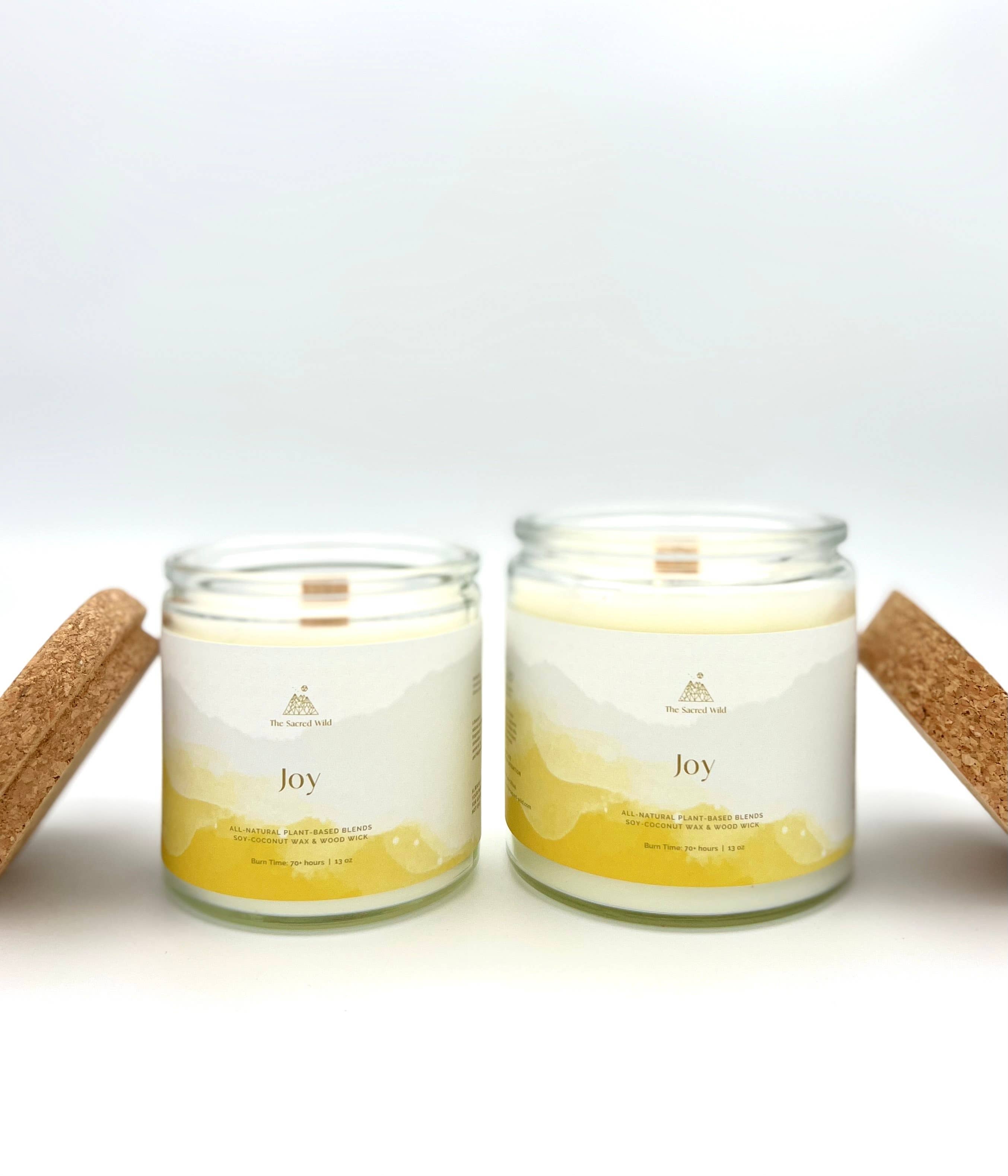 Two candles labeled 'Joy' on a white background