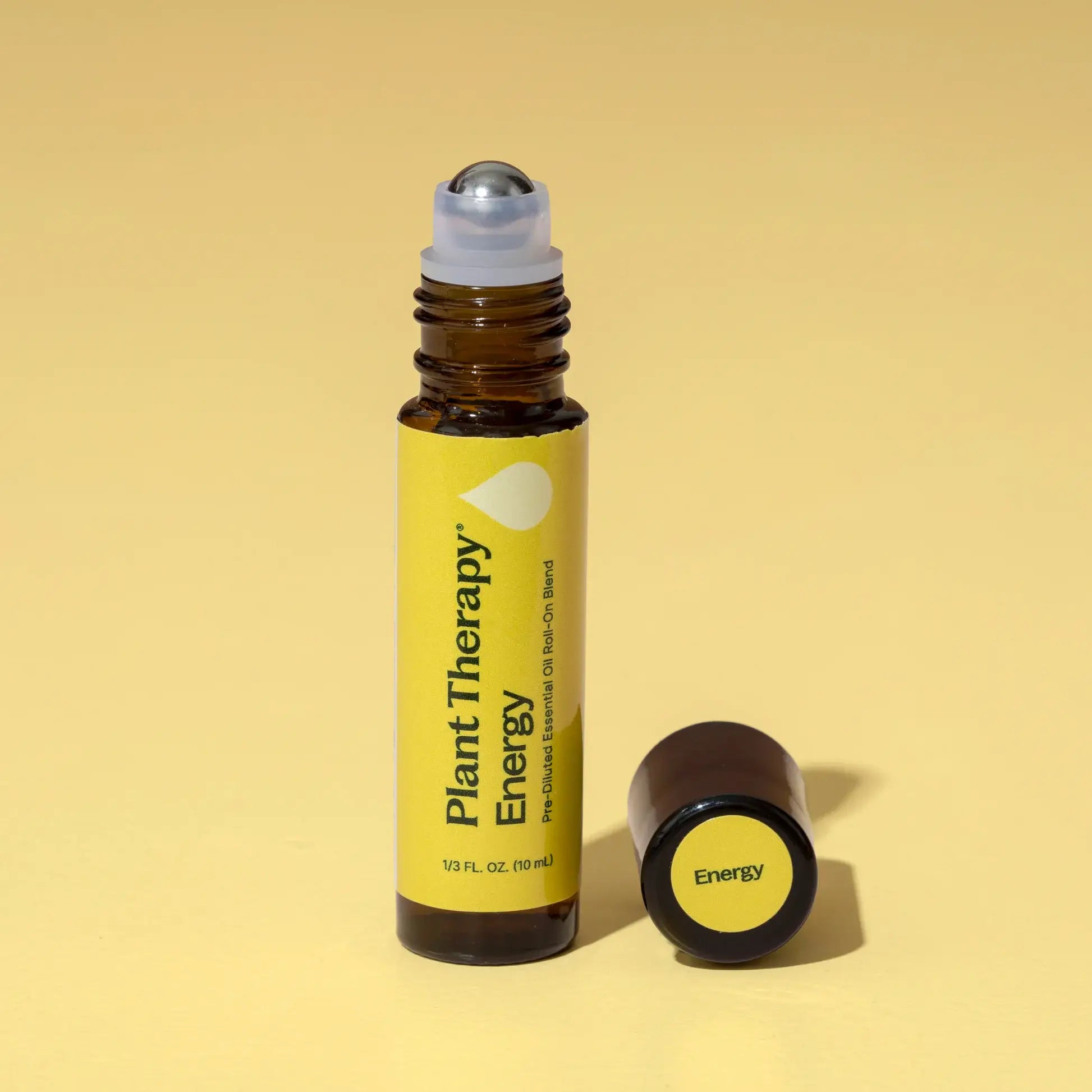Roll-on bottle labeled 'Plant Therapy Energy' on a yellow background - JOY - Journey Of You - Spiritual, Holistic, Empowering