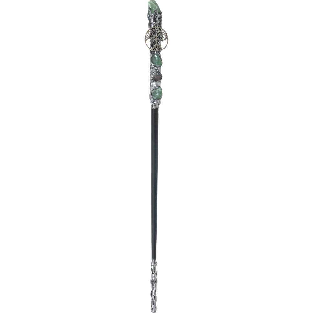 Decorative hair stick with green gemstones and silver accents on a white background