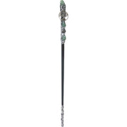 Decorative hair stick with green gemstones and silver accents on a white background