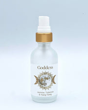 White bottle with gold cap labeled 'Goddess' on a light gray background