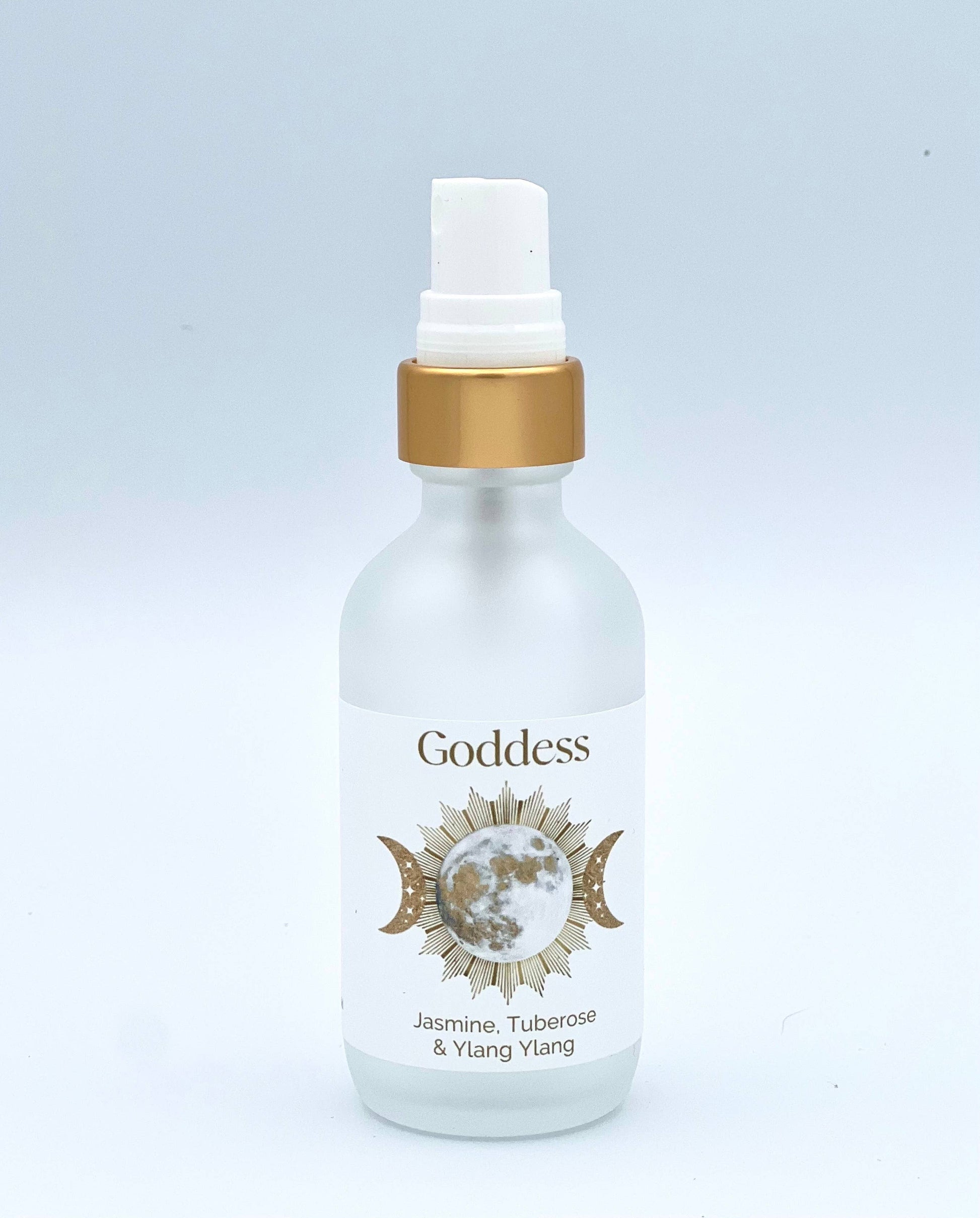 White bottle with gold cap labeled 'Goddess' on a light gray background
