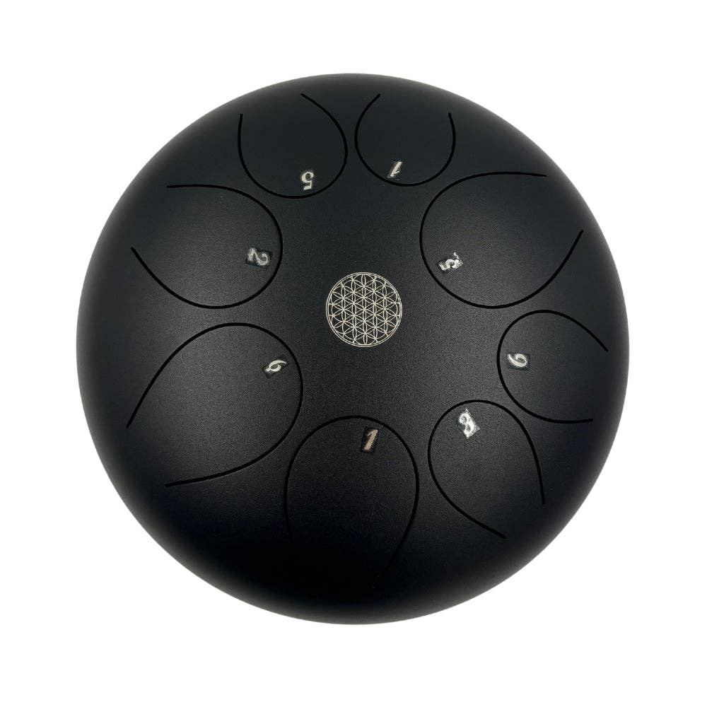 Black steel tongue drum with number markings on a white background