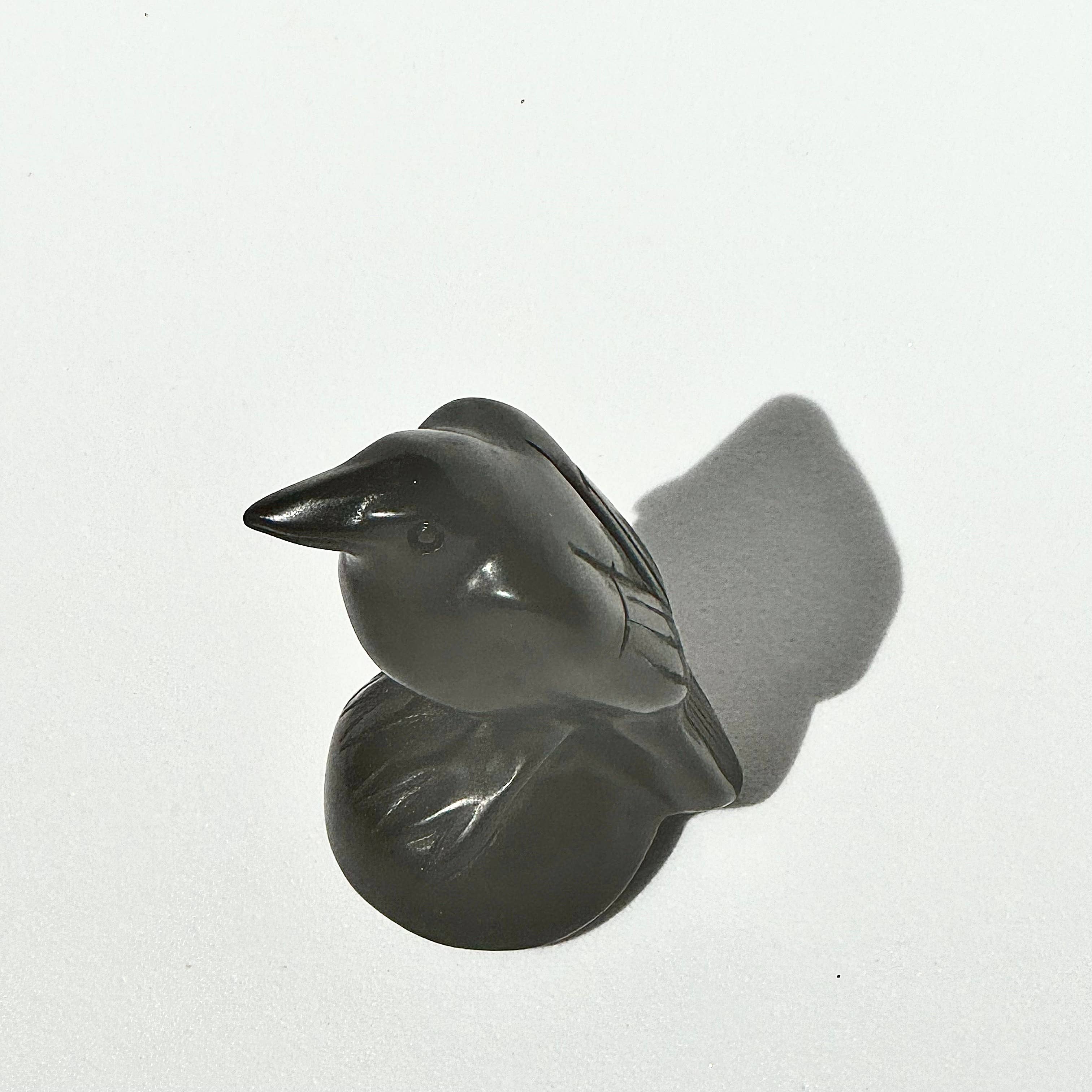 BLACK OBSIDIAN RAVEN CARVING - represent ancient wisdom, intelligence, and transformation - Obsidian is lustrous volcanic glass - excellent protective stone - external energies and protecting - against negativity - negative vibrations in the environment - clarity in healing - Joy - Journey of you