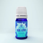 Blue bottle labeled 'Blue Lotus' with a white cap on a light blue background - JOY - Journey Of You - Spiritual, Holistic, Empowering