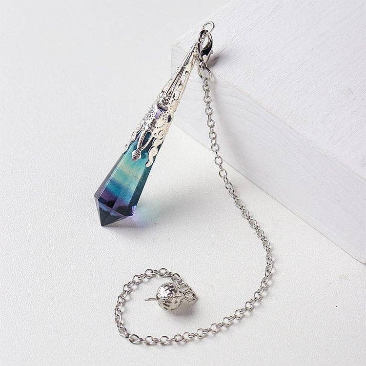 Crystal pendant with chain on a white background