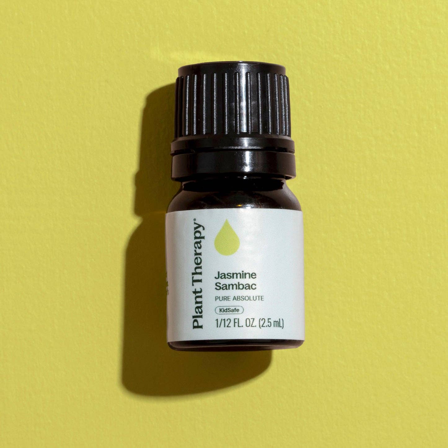 Bottle of Plant Therapy Jasmine Sambac essential oil on a yellow background - JOY - Journey Of You - Spiritual, Holistic, Empowering