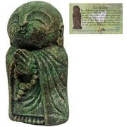 Green stone statue of a seated figure with text on a white background