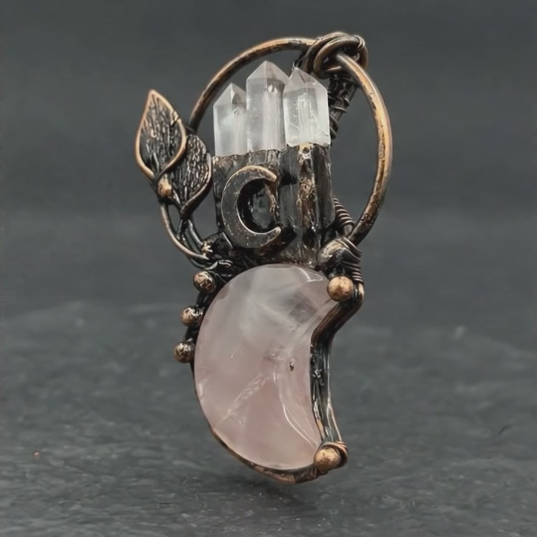 Load video: clear crystal moon plant shape pendant gemstone necklace
