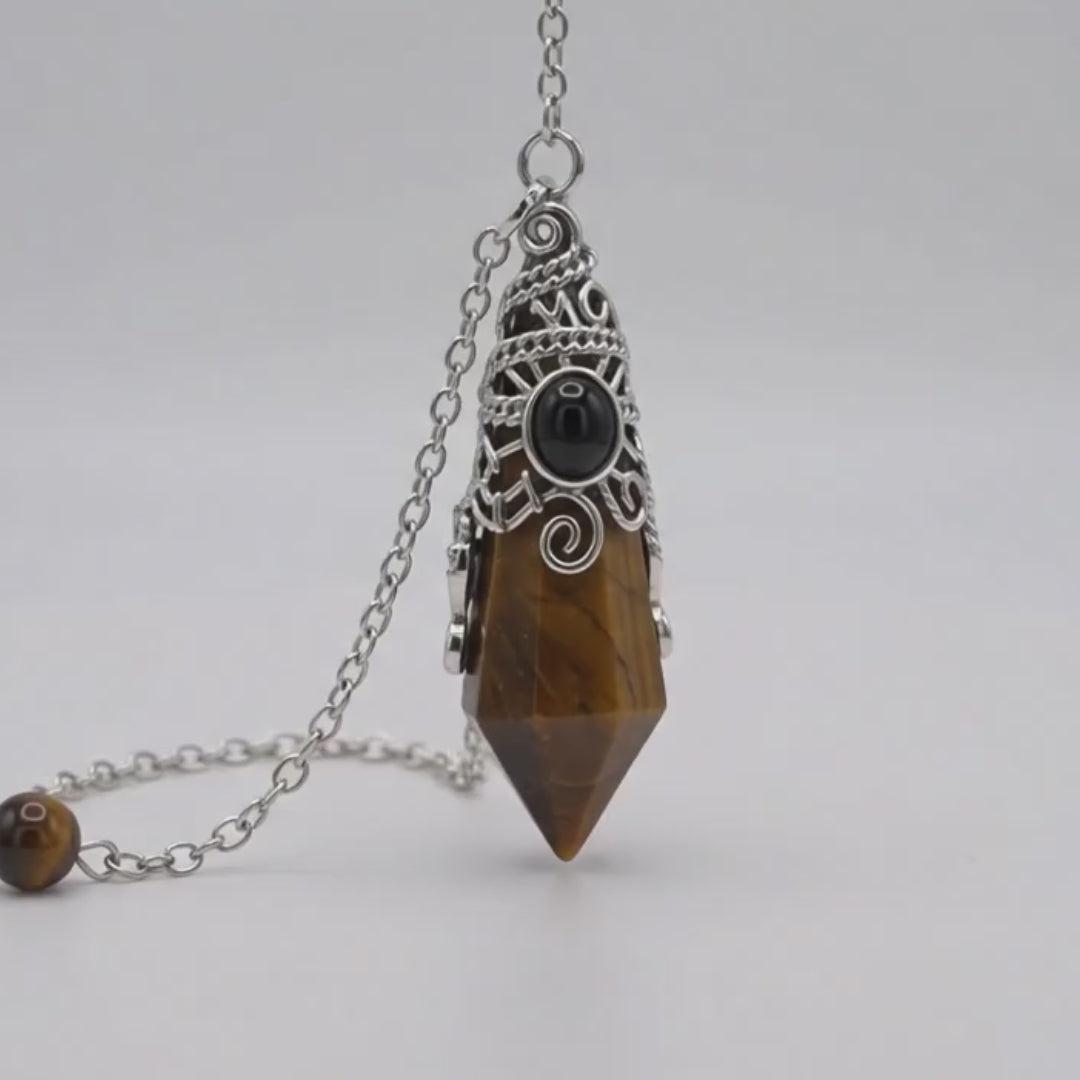Load video: Tiger Eye 12 Faceted Antique Silver Detailing Pendulum